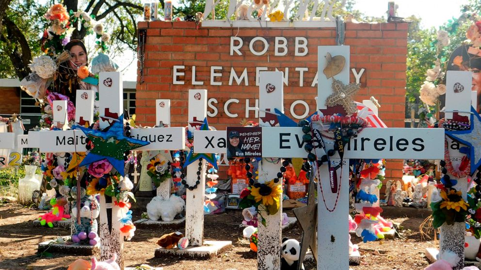 PHOTO: A memorial for the 19 children and two teachers killed in the May shooting sits outside of Robb Elementary on the first day of early voting in Uvalde, Texas, Oct. 24, 2022.  