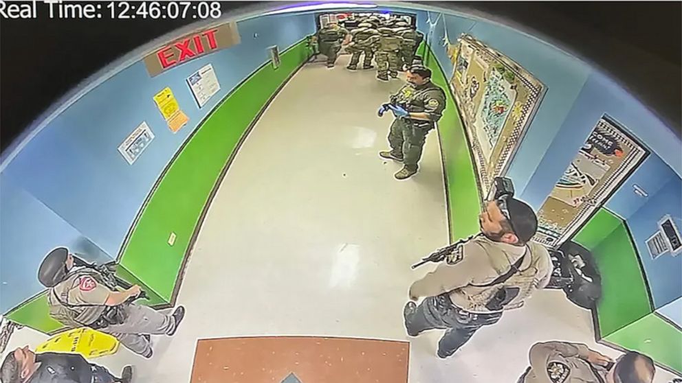 PHOTO: A CCTV image from inside Robb Elementary school, first obtained by The New York Times, shows officers in the hallway of the school in Uvalde, Texas, at 12:46 pm on May 24, 2022, according to the visible timestamp.