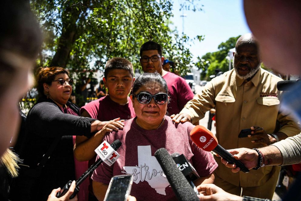 PHOTO: People are supporting Rosa Gonzalez, the friend of a family who lost their daughter, at the Robb Elementary school in Uvalde, Texas, on May 25, 2022.