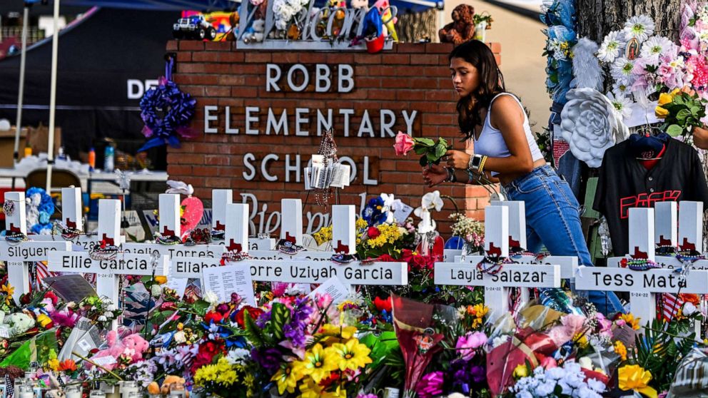 PHOTO: Flowers are laid at a makeshift memorial at Robb Elementary School in Uvalde, Texas, May 28, 2022.