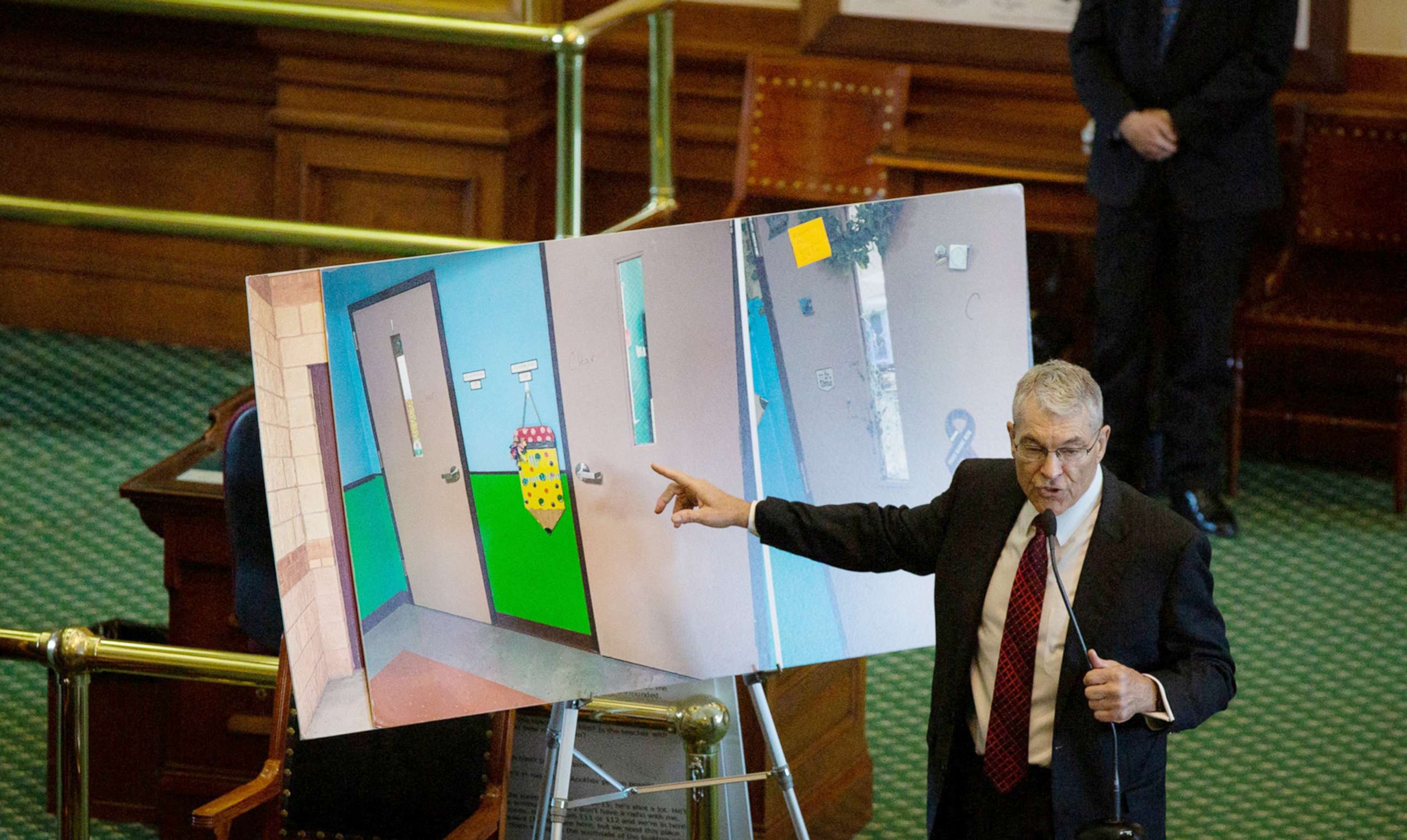 PHOTO: Department of Public Safety Director Steve McCraw uses photos of doors to present what happened during the school shooting at Robb Elementary School in Uvalde to the Texas during the hearing at the State Capitol in Austin, Texas, June 21, 2022.