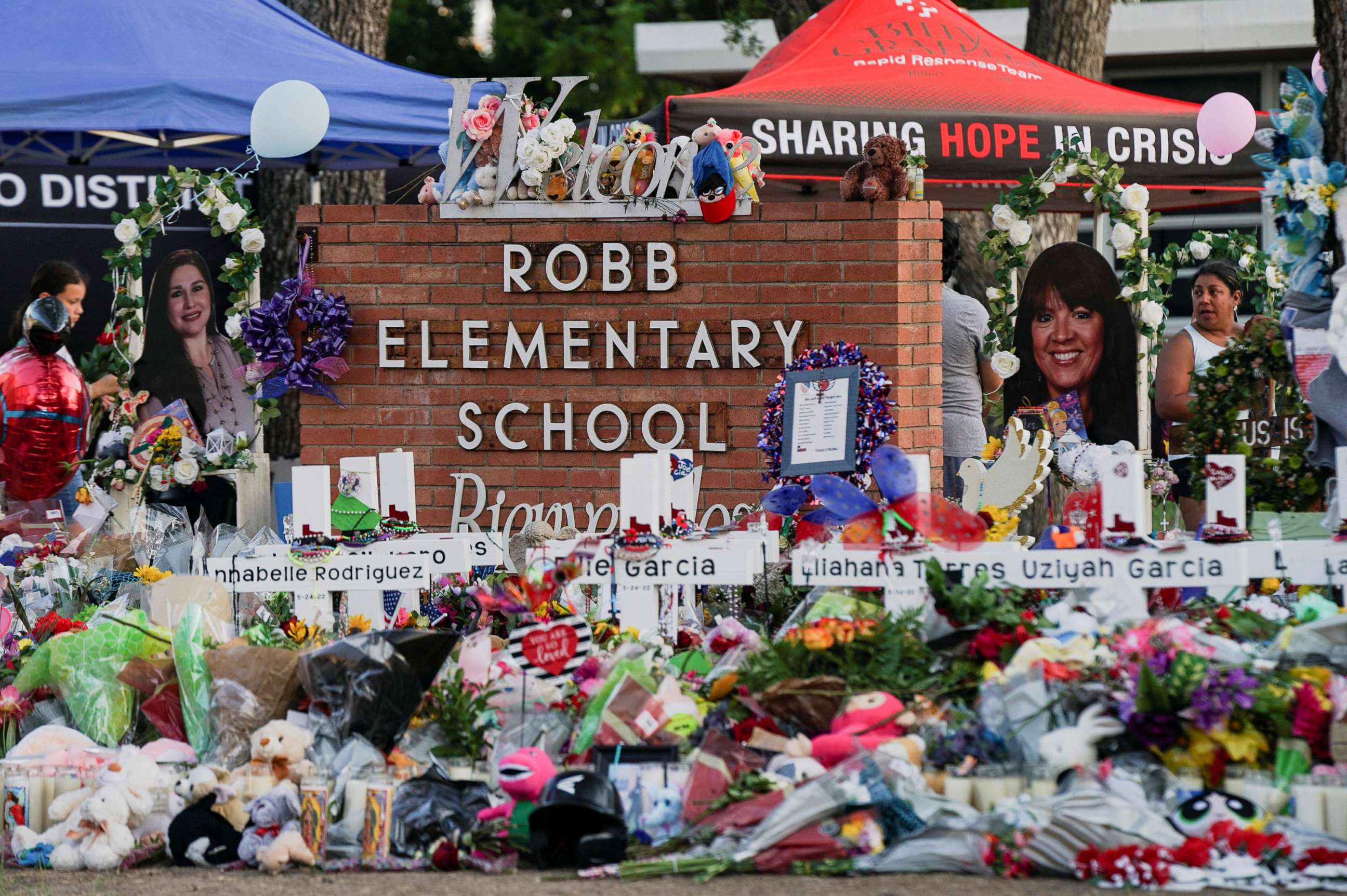 PHOTO: Flowers, toys, and other objects are seen at a memorial for the victims of the deadliest mass shooting in nearly a decade resulting in the death of 19 children and two teachers at Robb Elementary School in Uvalde, Texas, May 29, 2022. 