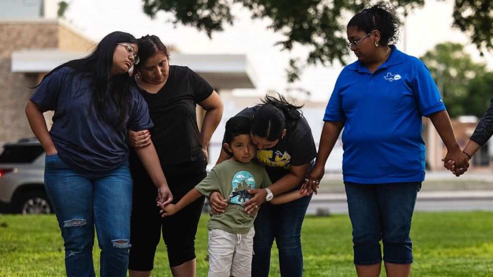 PHOTO: Members of the community gather at the City of Uvalde Town Square for a prayer vigil in the wake of a mass shooting at Robb Elementary School on May 24, 2022, in Uvalde, Texas.