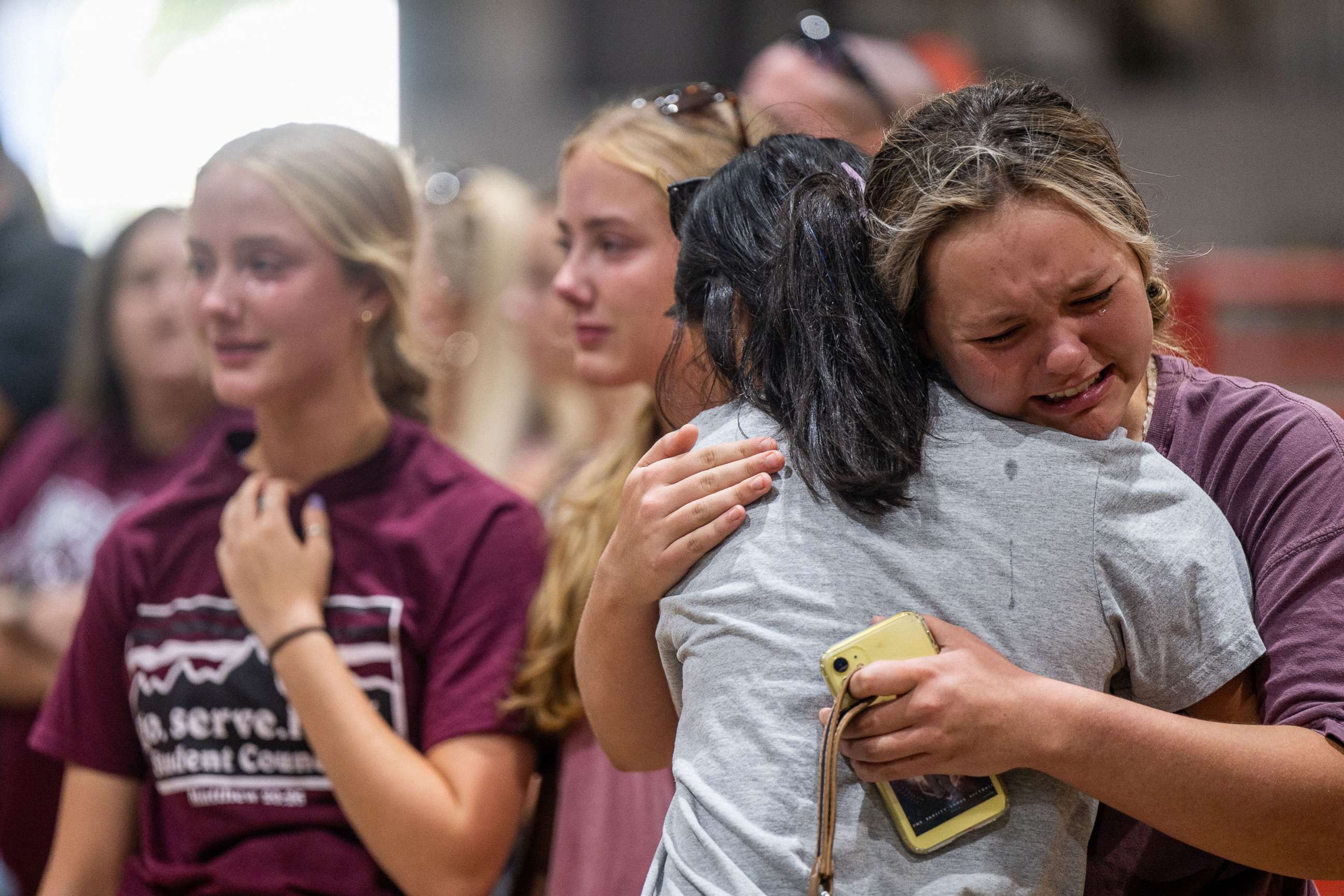 PHOTO: Community members embrace and mourn together at a vigil for the victims in the mass shooting at Rob Elementary School, May 25, 2022 in Uvalde, Texas.