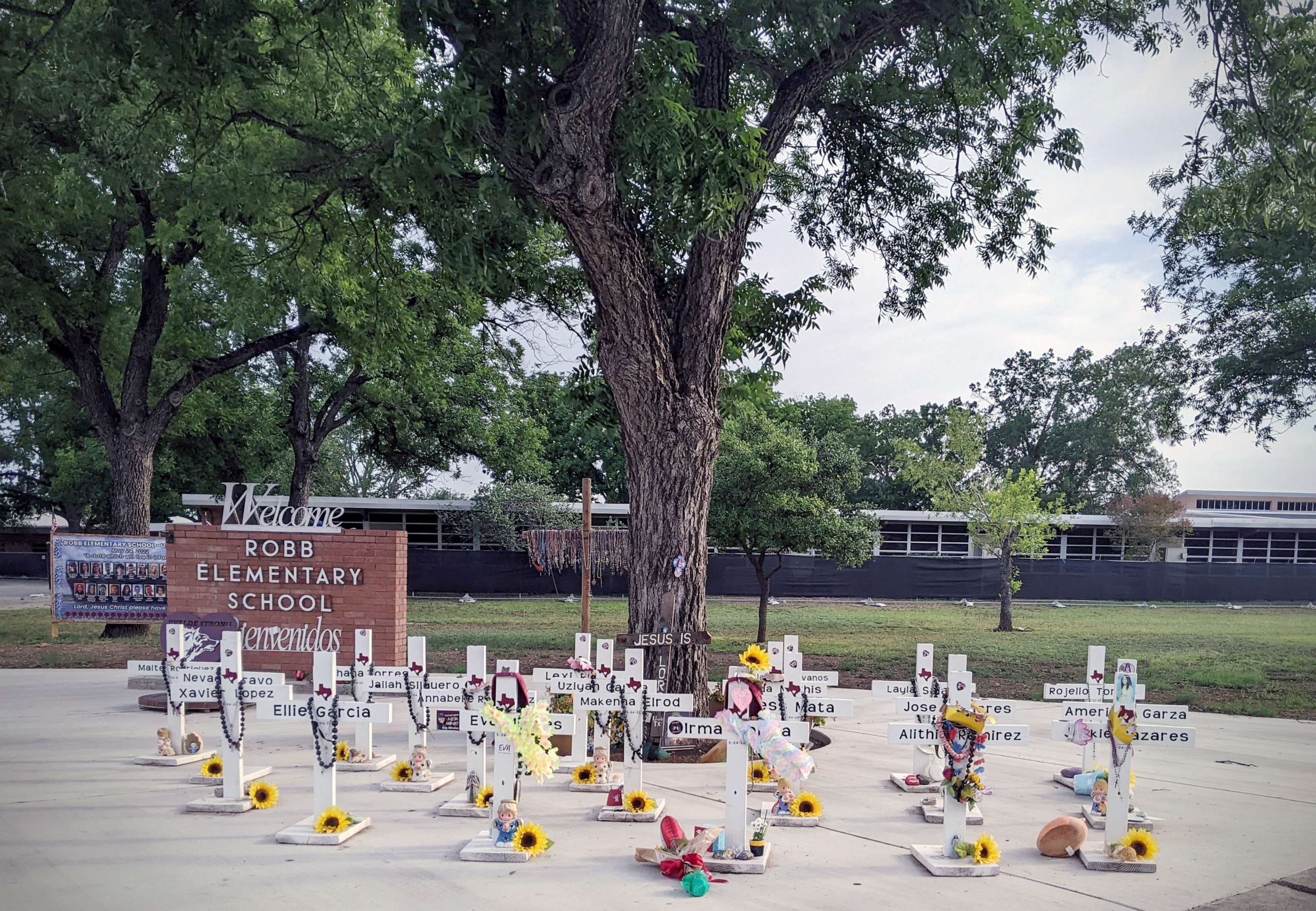 PHOTO: Crosses outside Robb Elementary School in Uvalde, Texas, are seen on May 7, 2023, with tributes to the 21 lives lost at the school.