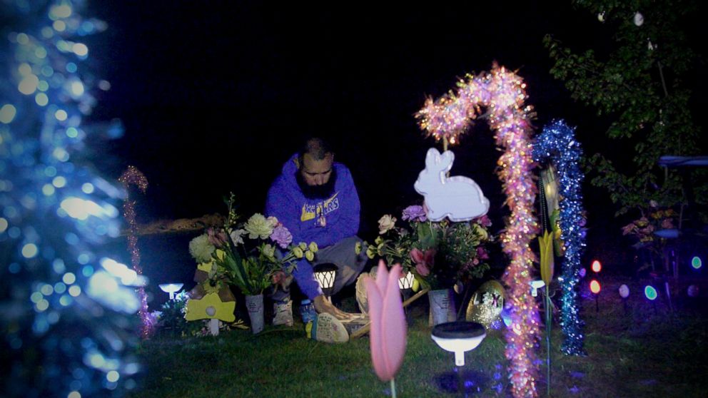 PHOTO: Felix Rubio places a hand he kissed onto his daughter Lexi’s gravesite in Uvalde, Texas, on March 28, 2023.