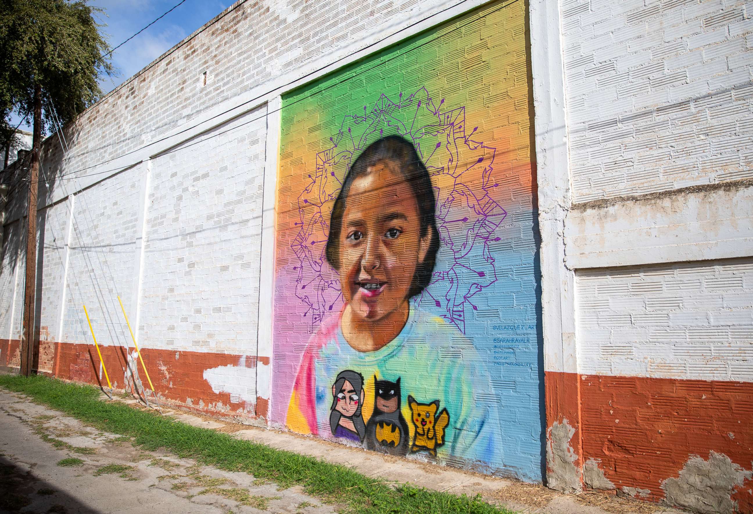 PHOTO: A mural in honor of Alithia Ramirez fills a panel of the wall on a building in downtown Uvalde, Texas, Aug. 21, 2022.