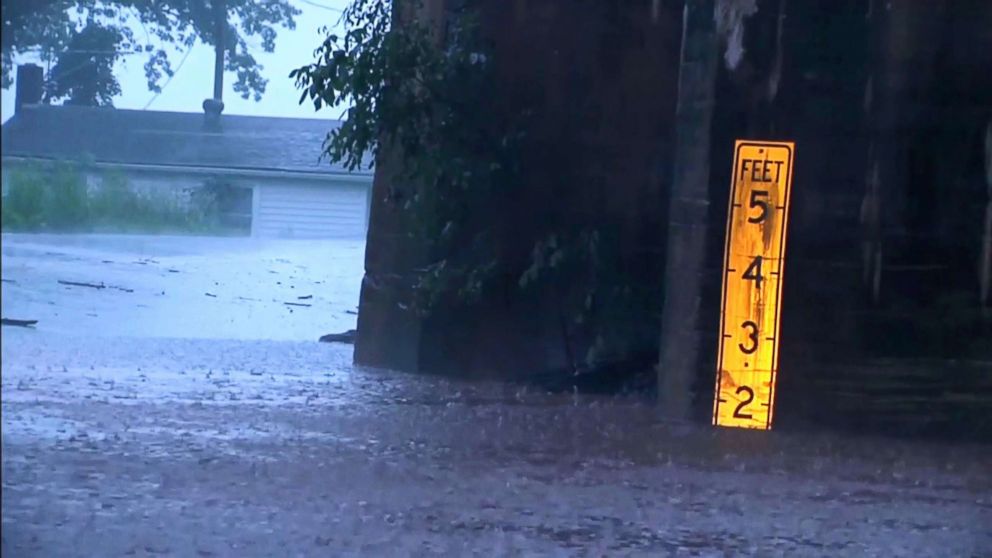 PHOTO: A marker shows deep water after flash flooding swamped roads in Virginia, May 30, 2018. 