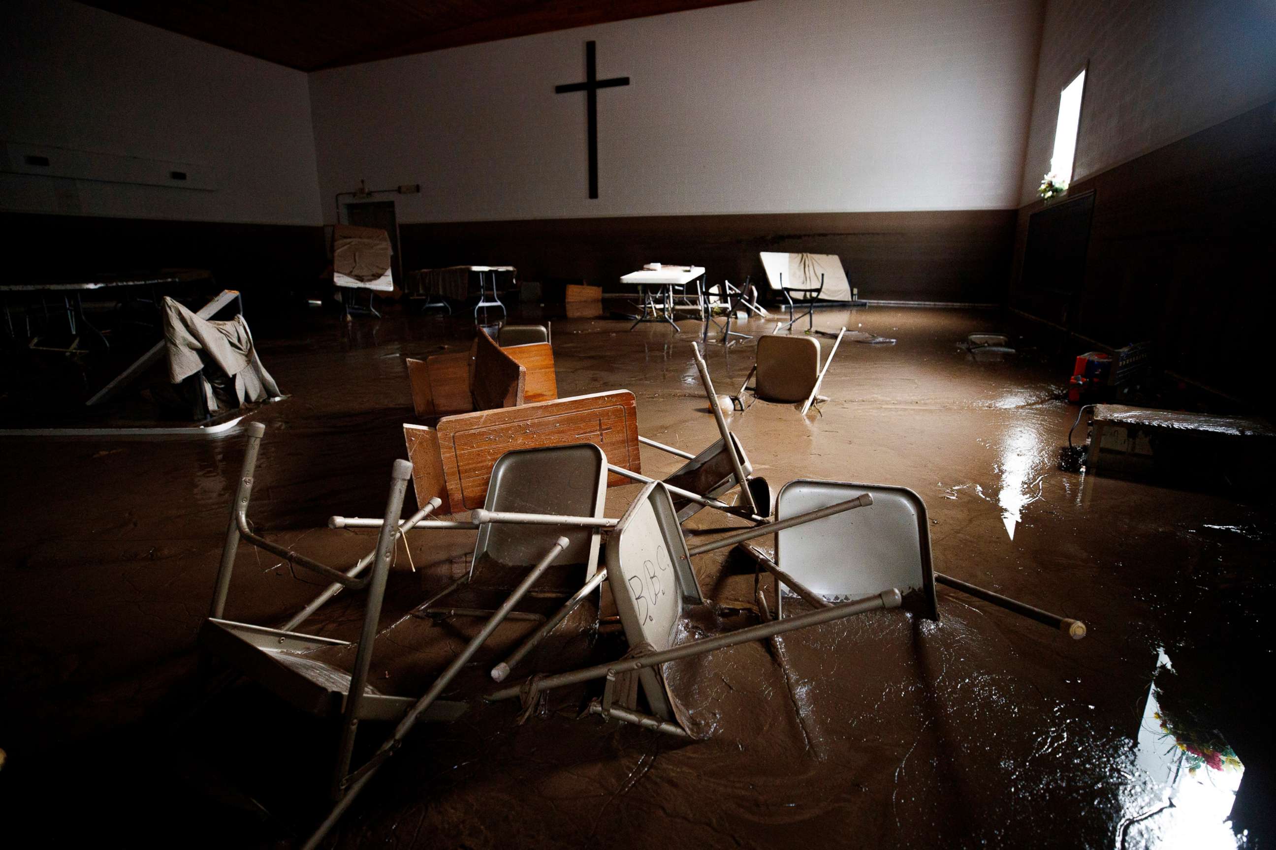 PHOTO: Chairs and pews lie in mud at Baptist Bible Church, July 14, 2022 in Whitewood, Va., following a flash flood.