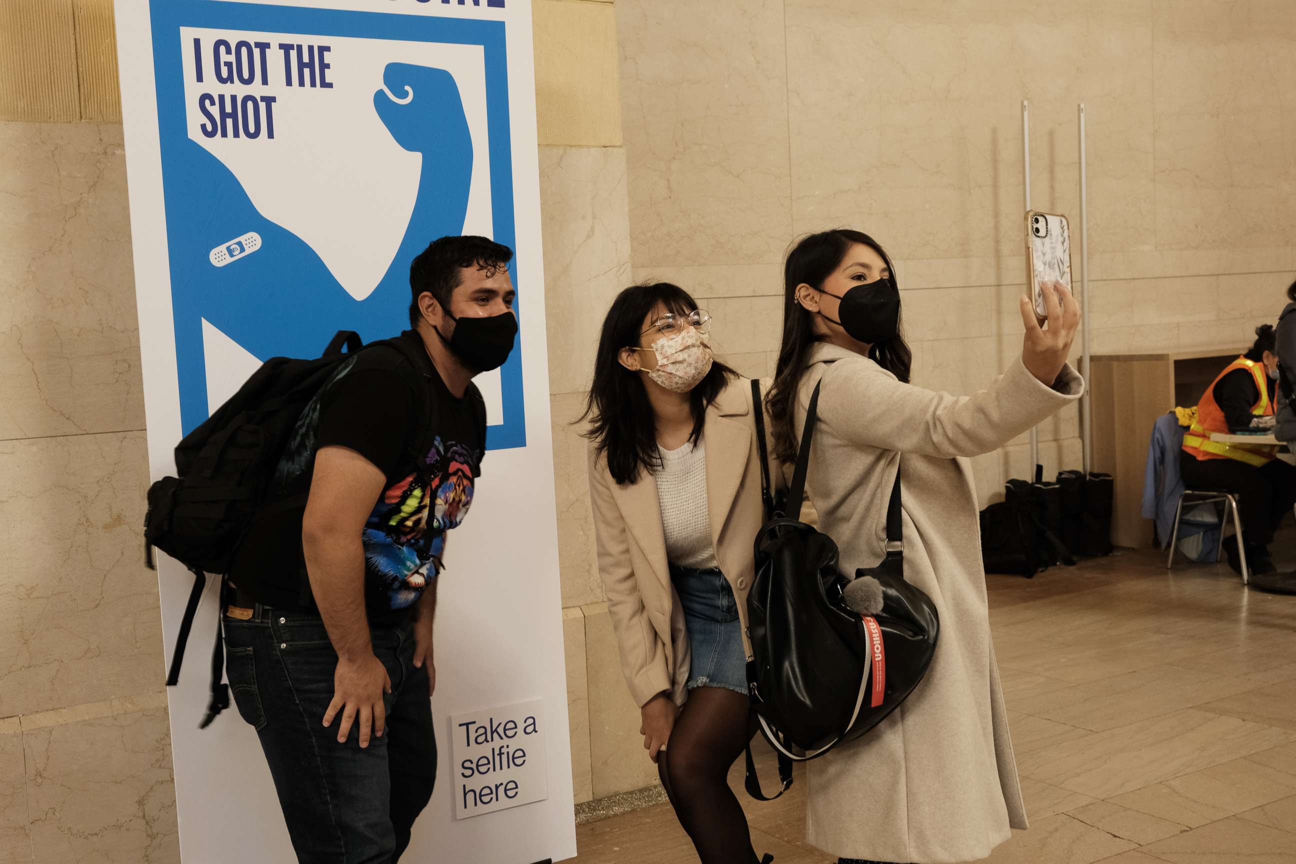 PHOTO: People pose for a picture after getting COVID-19 vaccinations at Grand Central Terminal on May 12, 2021 in New York City.