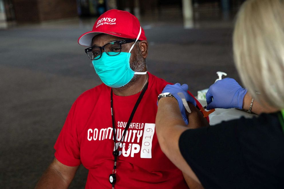PHOTO: A man receives his booster dose of the COVID-19 vaccine during an Oakland County Health Department vaccination clinic at the Southfield Pavilion on Aug. 24, 2021, in Southfield, Mich.