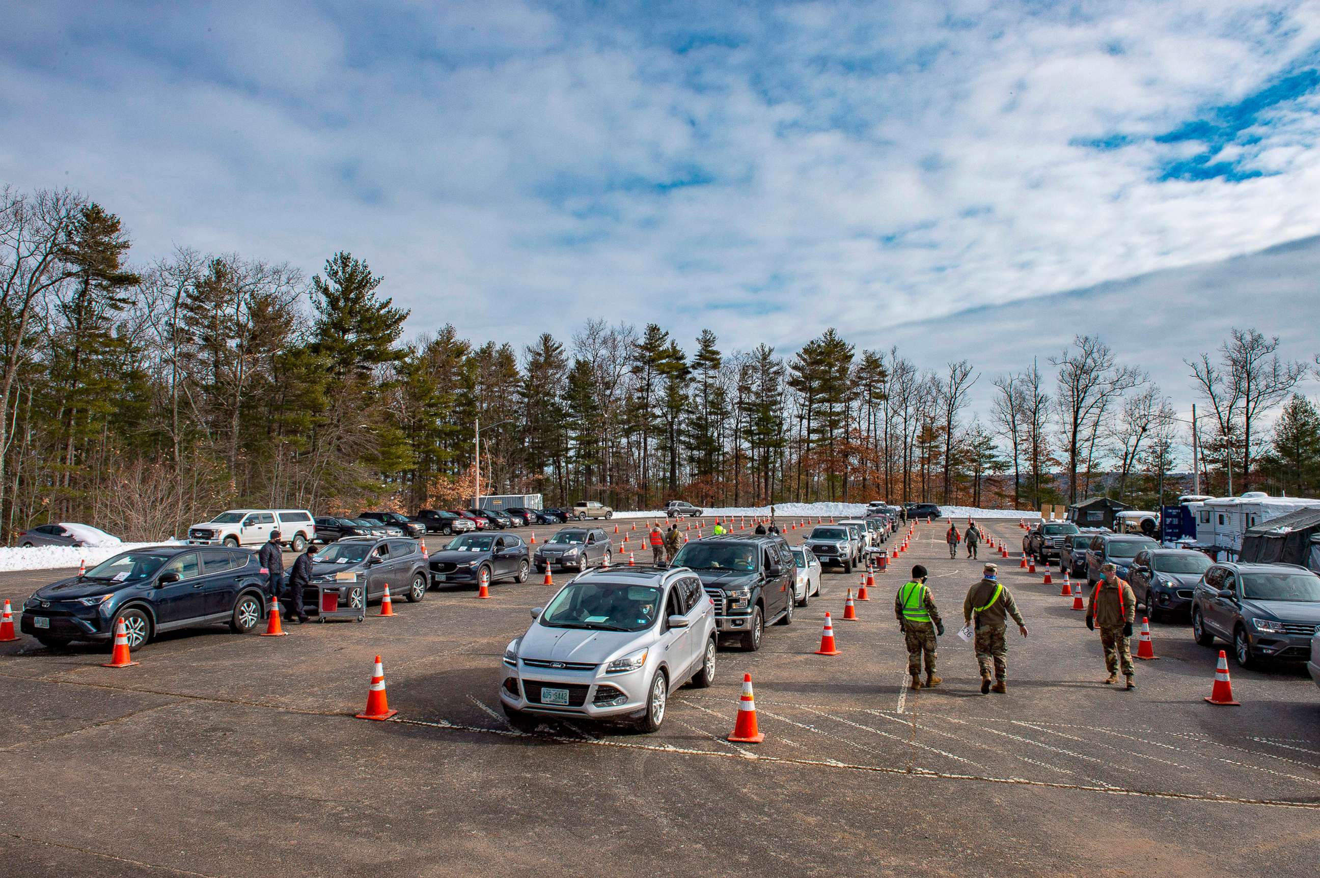 PHOTO: Cars line up at a vaccination center in Londonderry, N.H., Feb. 4, 2021.