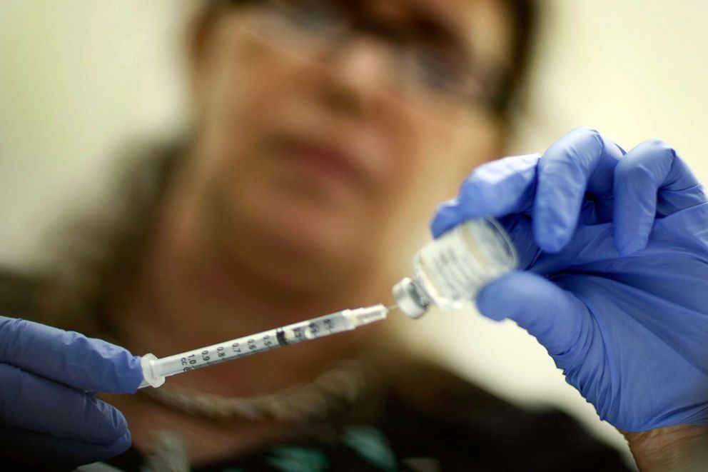 PHOTO: A registered nurse measures out an H1N1 vaccine shot, Nov. 3, 2009, in Miami.