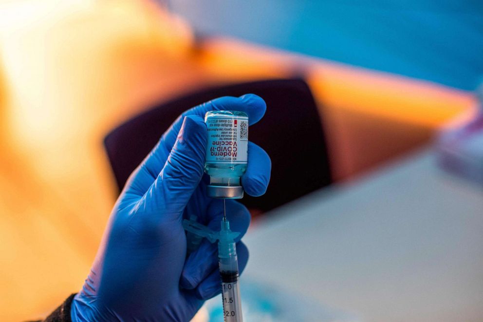 PHOTO: Medical workers load syringes with the Moderna Covid-19 vaccine to be administered by nurses at a vaccination site at Kedren Community Health Center in Los Angeles, Feb. 16, 2021.