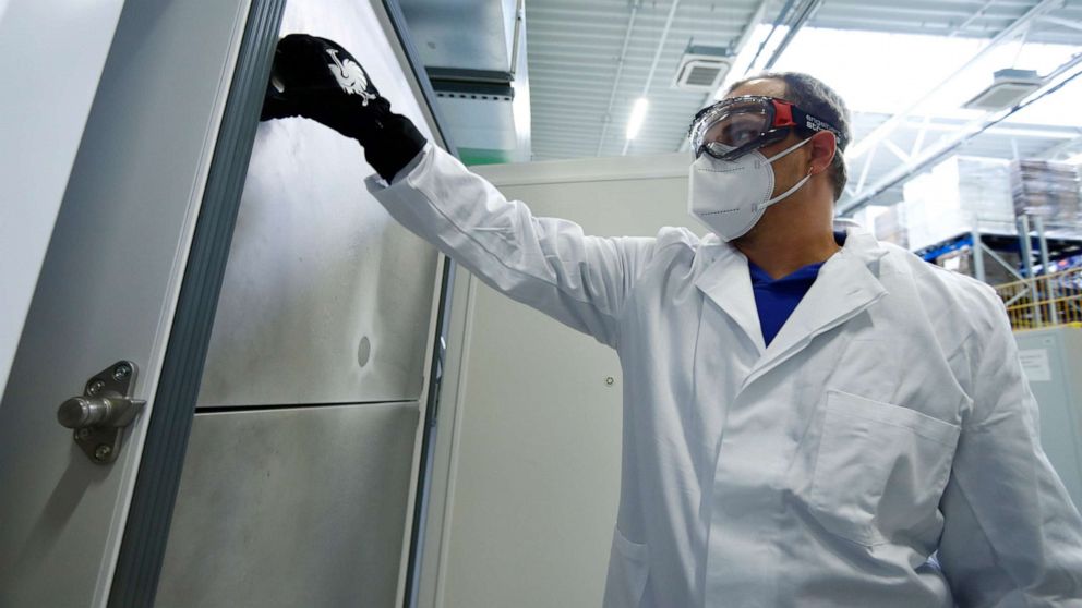 PHOTO: AAn employee opens an ultra-cold refrigerator filled with vaccines against COVID-19 at a secret storage facility in the Rhein-Main area, Germany, Dec. 4, 2020.