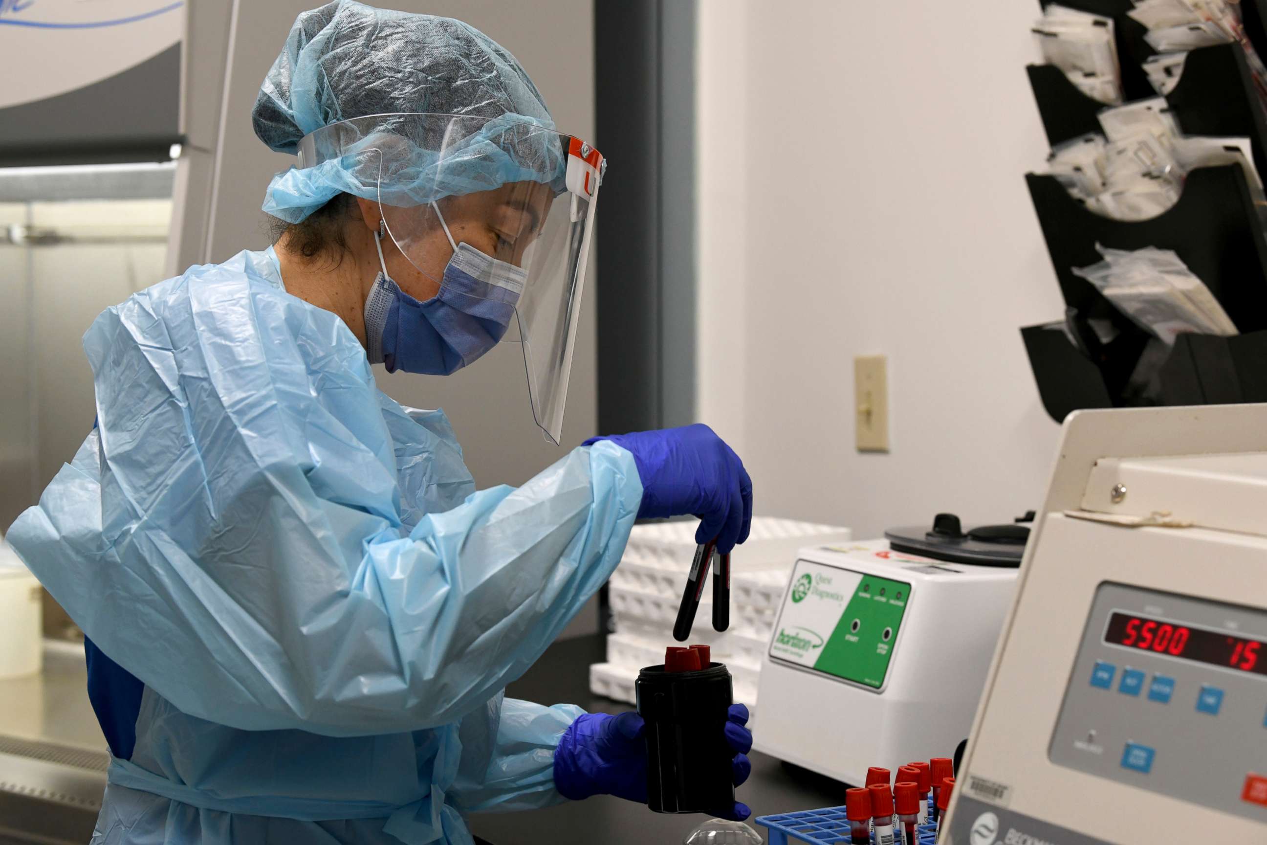 PHOTO: A technician at the University of Miami Miller School of Medicine processes blood samples from study participants in the specimen processing lab in Miami, Sept. 2, 2020. Volunteers are taking part in testing the NIH funded Moderna COVID-19 vaccine.
