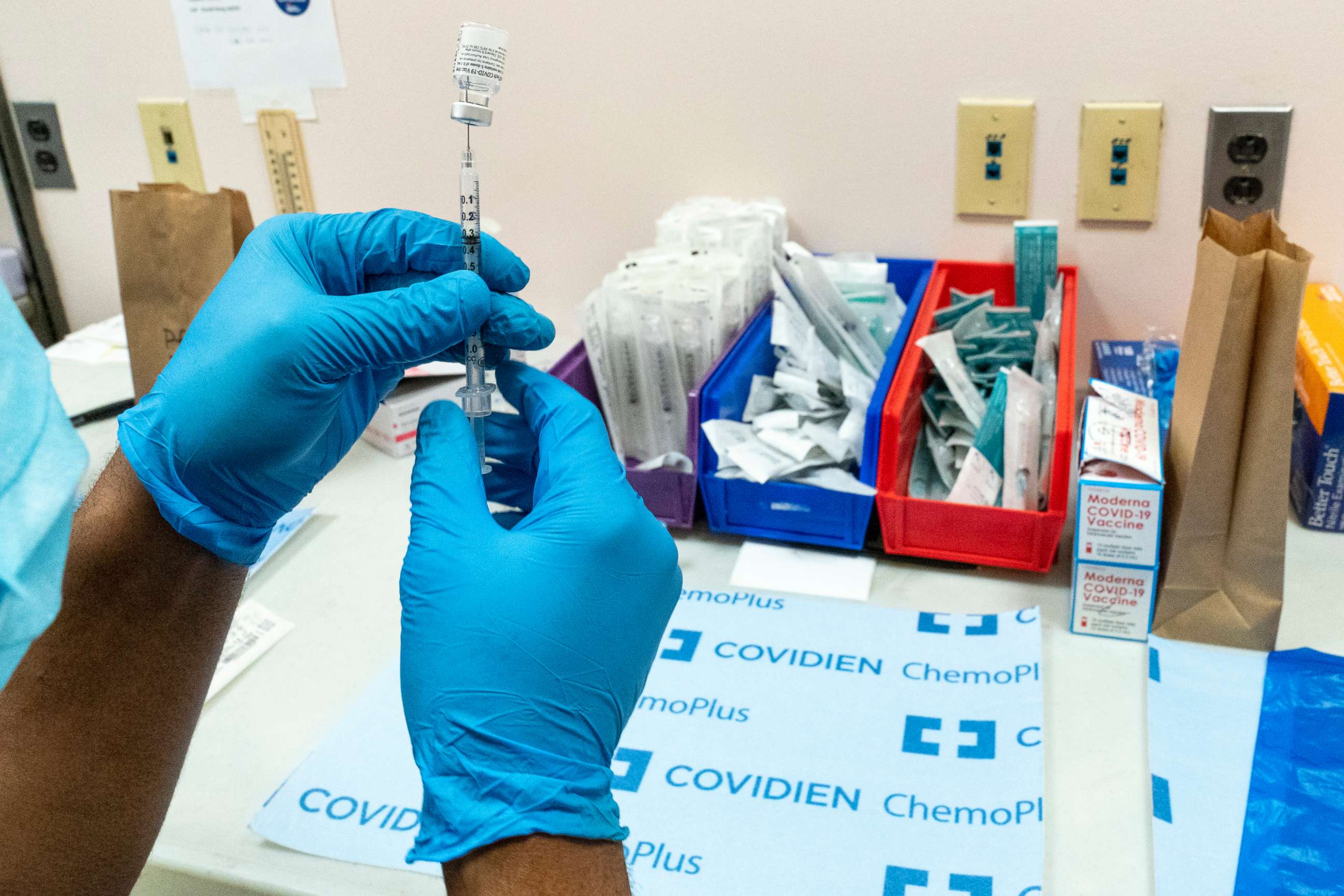 PHOTO: A pharmacist prepares a syringe with the Pfizer-BioNTech COVID-19 vaccine at a COVID-19 vaccination site, Feb. 18, 2021, in New York.