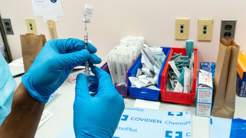 PHOTO: A pharmacist prepares a syringe with the Pfizer-BioNTech COVID-19 vaccine at a COVID-19 vaccination site, Feb. 18, 2021, in New York.