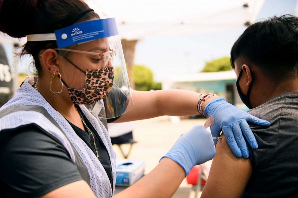 PHOTO: A 17-year-old receives a first dose of the Pfizer Covid-19 vaccine at a mobile vaccination clinic at the Weingart East Los Angeles YMCA in Los Angeles, Aug. 7, 2021.