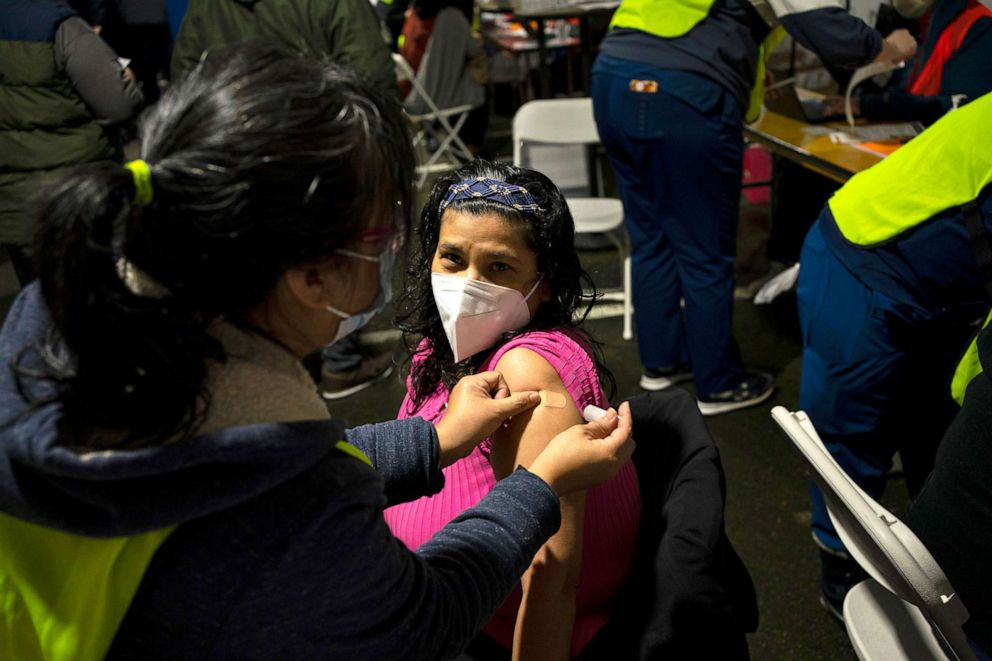 PHOTO: Miriam Olloa gets a bandage after receiving a COVID-19 vaccination on Feb. 4, 2021 in Federal Way, Washington. Swedish Medical Center held a mobile vaccination clinic at the Pacific Islander Community Association of Washington.