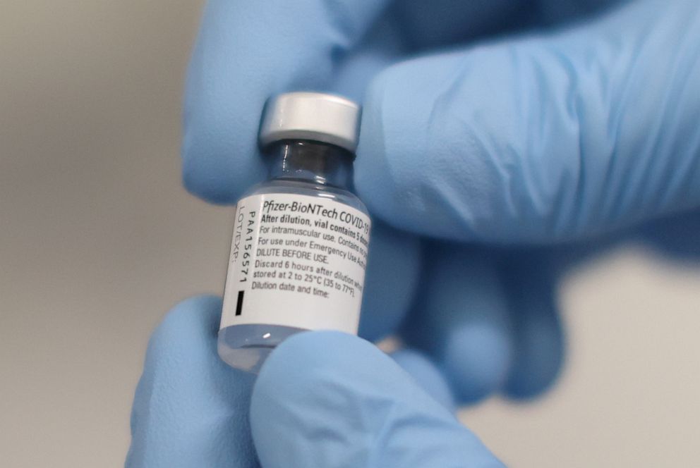 FILE PHOTO: A vial of the Pfizer/BioNTech COVID-19 vaccine is seen ahead of being administered at the Royal Victoria Hospital, on the first day of the largest immunisation programme in the British history, in Belfast, Northern Ireland December 8, 2020. 