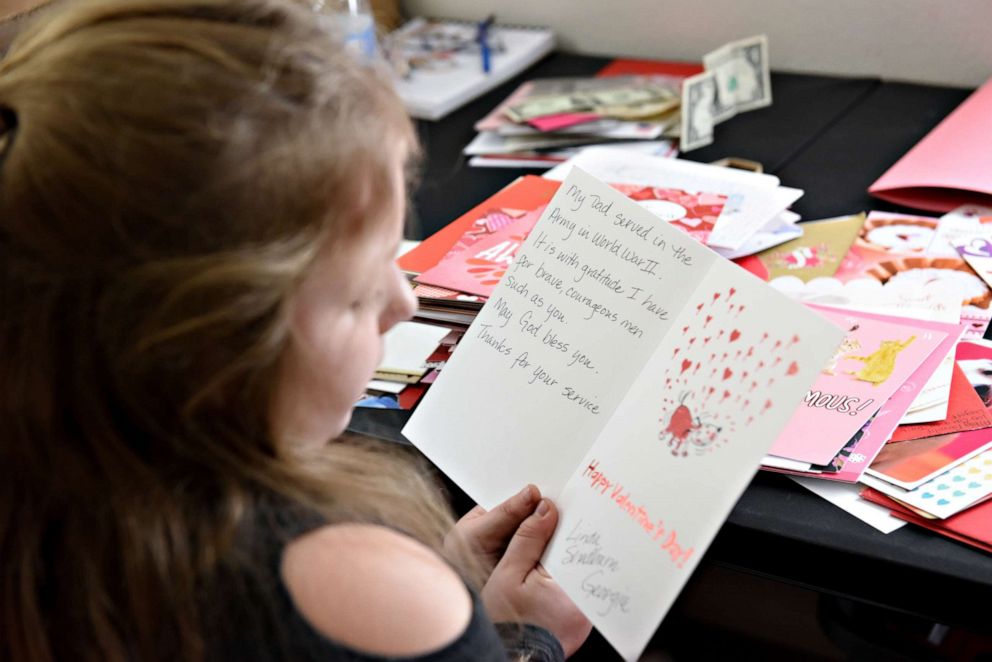 PHOTO: Nicole Sawyer, 7-year-old great granddaughter of Major Bill White, reads Valentine's Day cards sent to White in Stockton, Calif., Jan. 31, 2020.