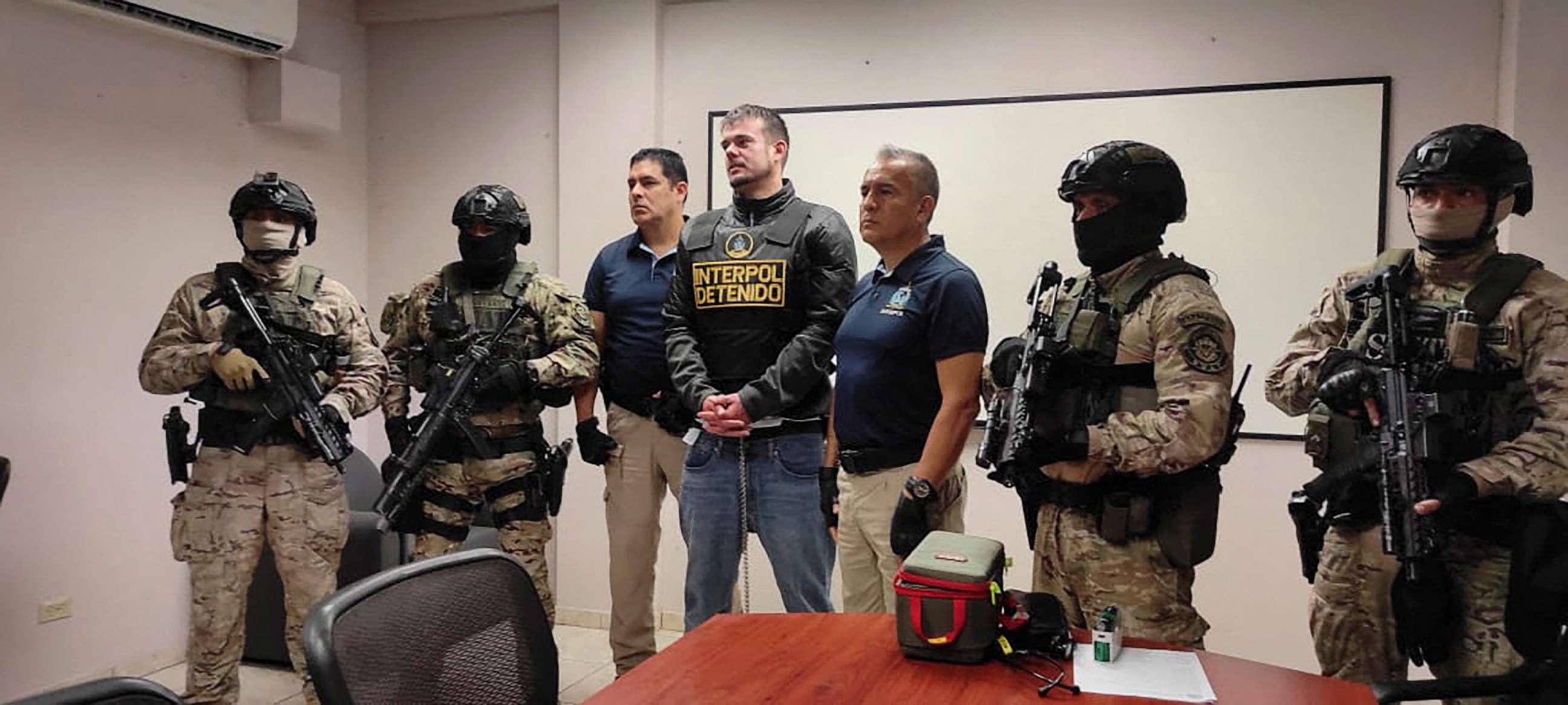 PHOTO: Dutch citizen Joran van der Sloot stands with security forces previous to his extradition to the U.S., in Lima, Peru June 8, 2023.