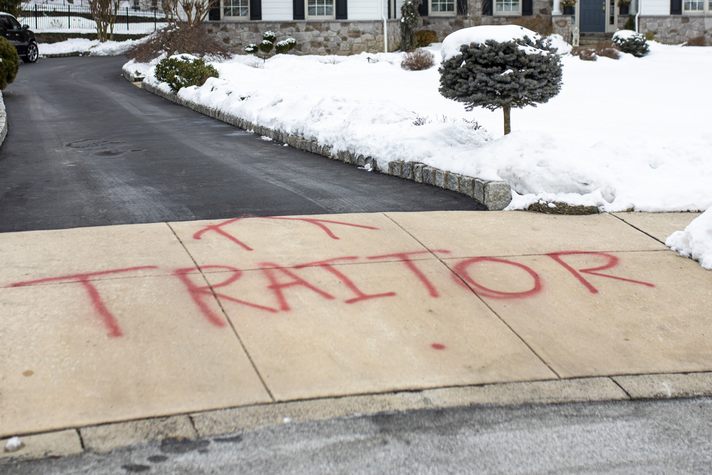 PHOTO: Graffiti is spray painted on the driveway outside of attorney Michael van der Veen's suburban Philadelphia home, Feb. 13, 2021.
