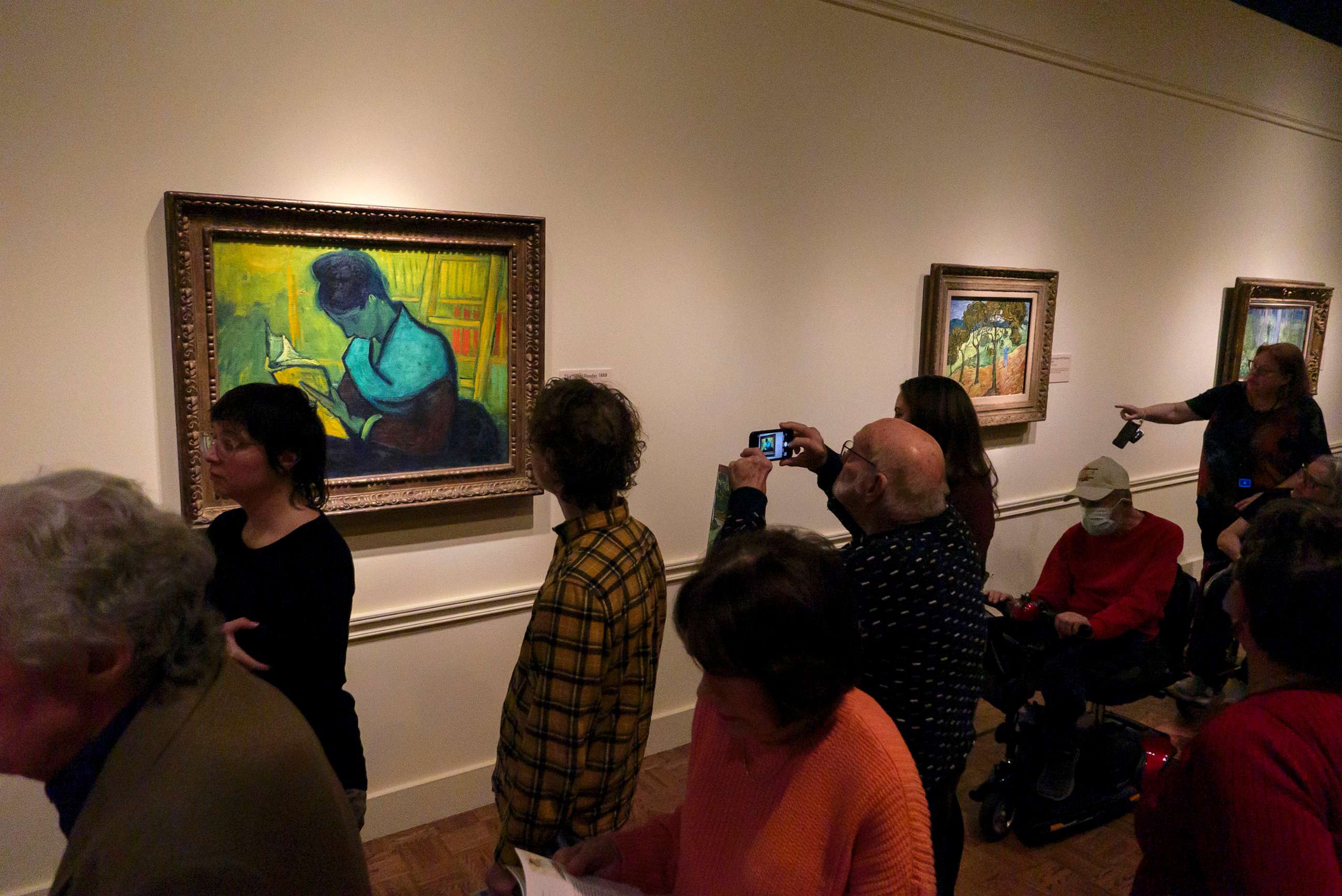 PHOTO: Visitors file past at the Van Gogh painting "Une Liseuse De Romans", also known as "The Novel Reader", during the Van Gogh in America exhibit at the Detroit Institute of Arts, Jan. 11, 2023, in Detroit.