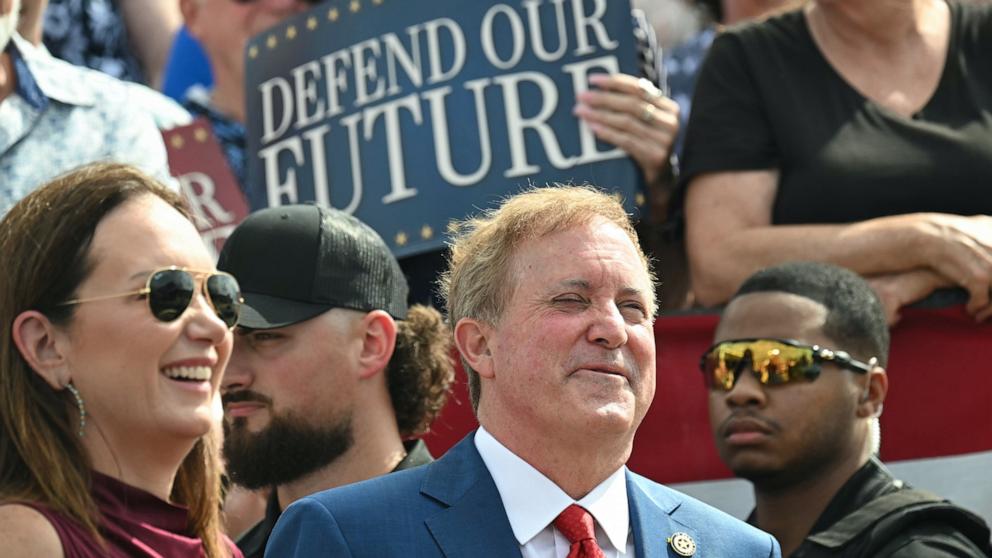 PHOTO: Republican Senate candidate, Texas Attorney General Ken Paxton looks on as U.S. Vice President JD Vance speaks during a campaign rally at Tyler Pounds Regional Airport, October 13, 2026 in Tyler, Texas.