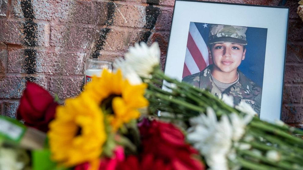 PHOTO: Flowers are laid in front of a photos of murdered Army Spec. Vanessa Guillen, July 12, 2020, in Austin, Texas.