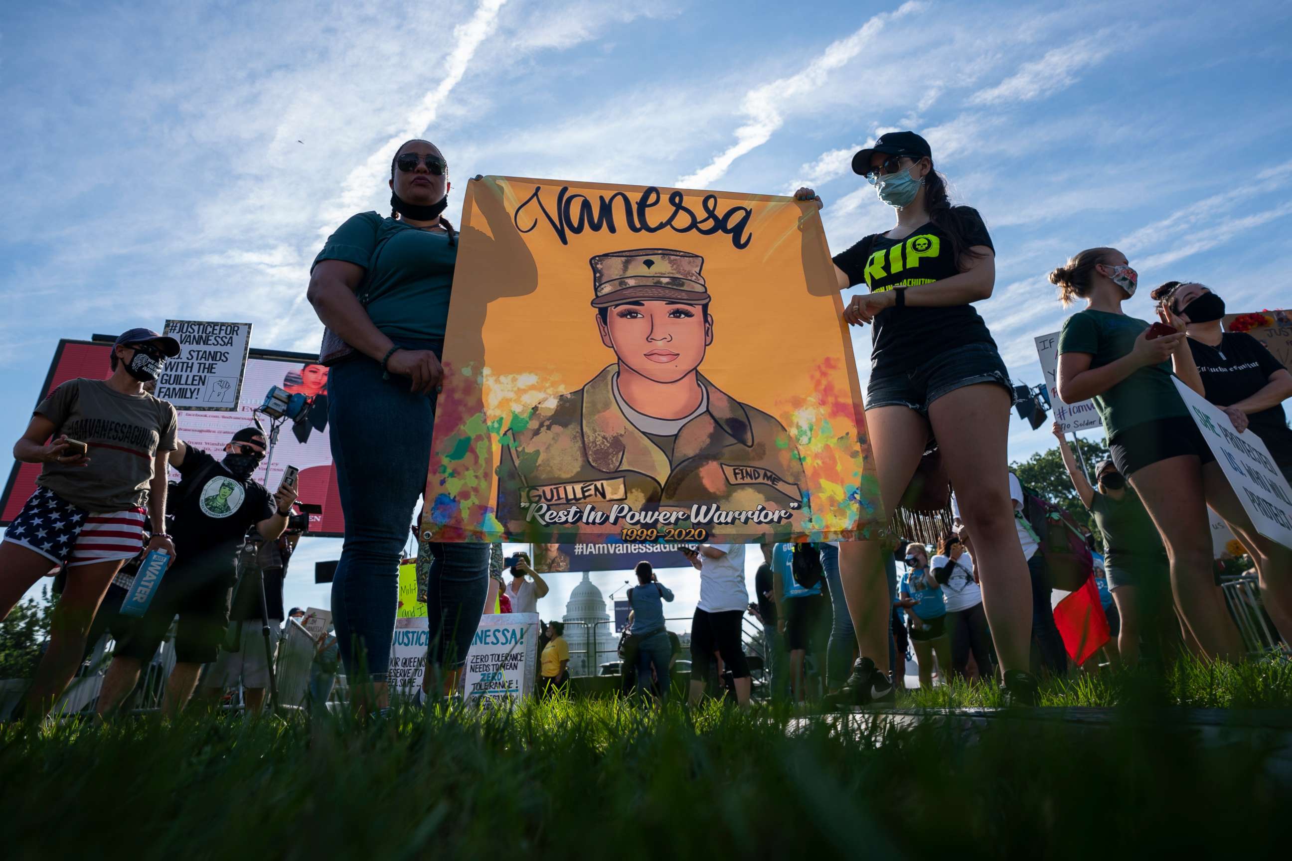 PHOTO: Supporters of the family of slain Army Spc. Vanessa Guillen gather before a news conference on the National Mall in front of Capitol Hill, July 30, 2020, in Washington.