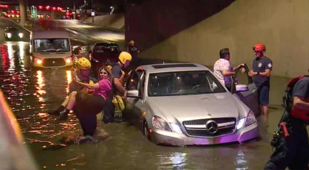 PHOTO: Rescue crews help people in cars stuck in flooded roads in the Las Vegas area, July 28, 2022, after heavy rains caused flash floods.