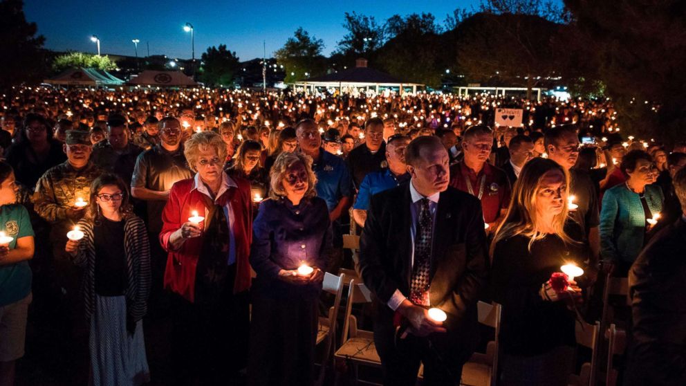 Las Vegas Mayor Carolyn Goodman and a large crowd of people hold candles at a memorial service for Charleston Hartfield, a Las Vegas police officer who was killed on Oct. 1, 2017 when a gunman opened fire on a county music festival, in Las Vegas, Nevada, Oct. 5, 2017.