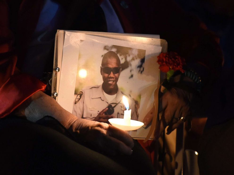 PHOTO: Las Vegas Mayor Carolyn Goodman holds a photo of police officer Charleston Hartfield at his memorial service in Las Vegas, Oct. 5, 2017. Hartfield was killed on Oct. 1, 2017 when a gunman opened fire on a county music festival, in Las Vegas.
