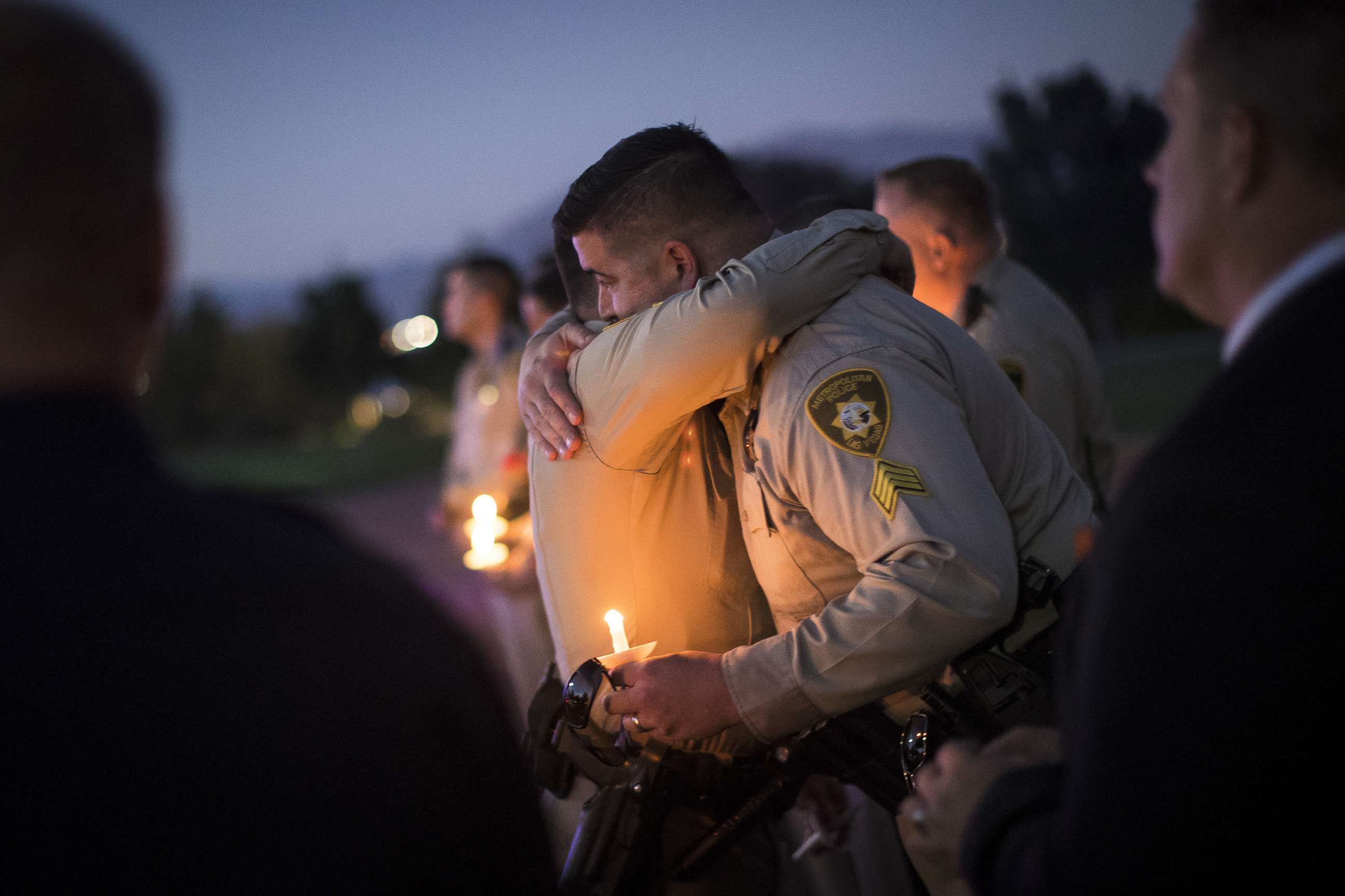 PHOTO: Sgt. Ryan Fryman, who was on the scene of the mass shooting, hugs a fellow officer during a vigil, Oct. 5, 2017 in Las Vegas for Police Officer Charleston Hartfield, who was killed when a gunman opened fire on a crowd attending a music festival.  