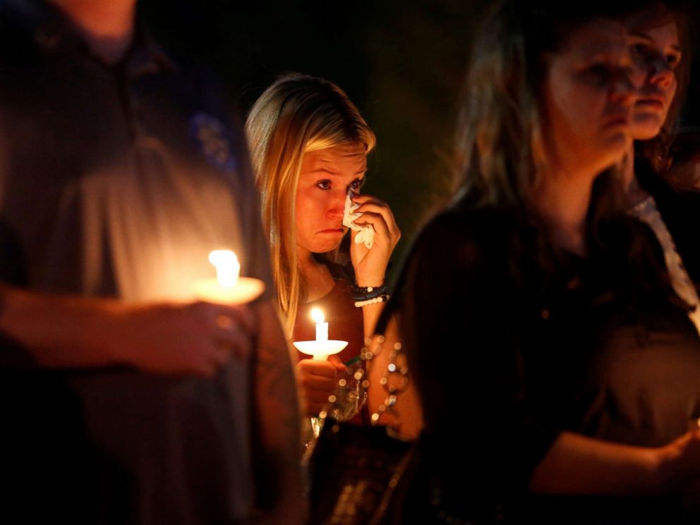 PHOTO: A woman wipes away tears during a memorial service for Charleston Hartfield, an off-duty Las Vegas police officer who was killed during the Route 91 music festival mass shooting, in Las Vegas, Nevada, Oct. 5, 2017.