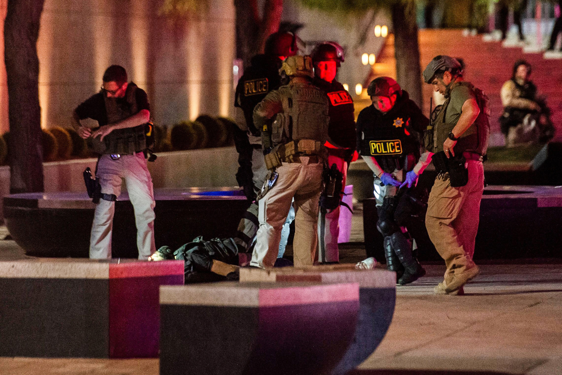 PHOTO: Police officers surround a person that was shot near the 300 block of South Las Vegas Boulevard, on June 1, 2020, in downtown Las Vegas.