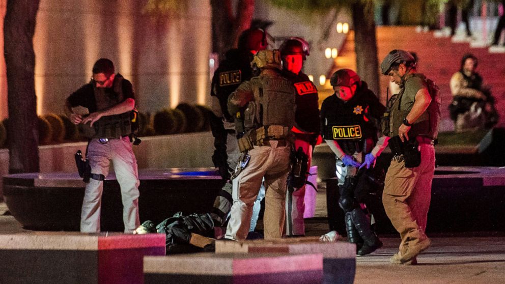 PHOTO: Police officers surround a person that was shot near the 300 block of South Las Vegas Boulevard, on June 1, 2020, in downtown Las Vegas.