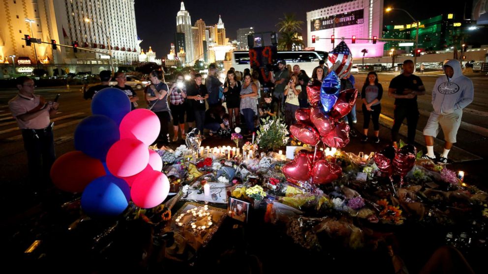 PHOTO: People gather at a makeshift memorial in the middle of Las Vegas Boulevard following the mass shooting in Las Vegas, Oct. 4, 2017.