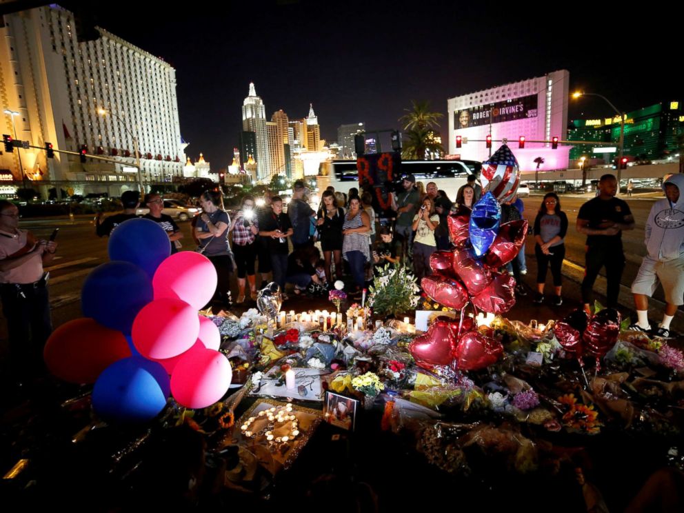 PHOTO: People gather at a makeshift memorial in the middle of Las Vegas Boulevard following the mass shooting in Las Vegas, Oct. 4, 2017.