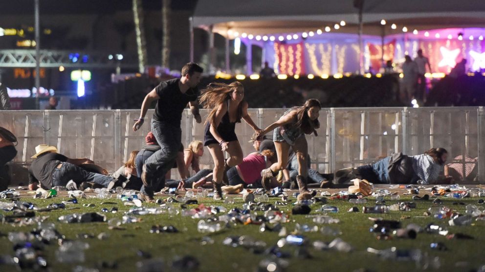 PHOTO: People run from the Route 91 Harvest country music festival, Oct. 1, 2017, in Las Vegas.