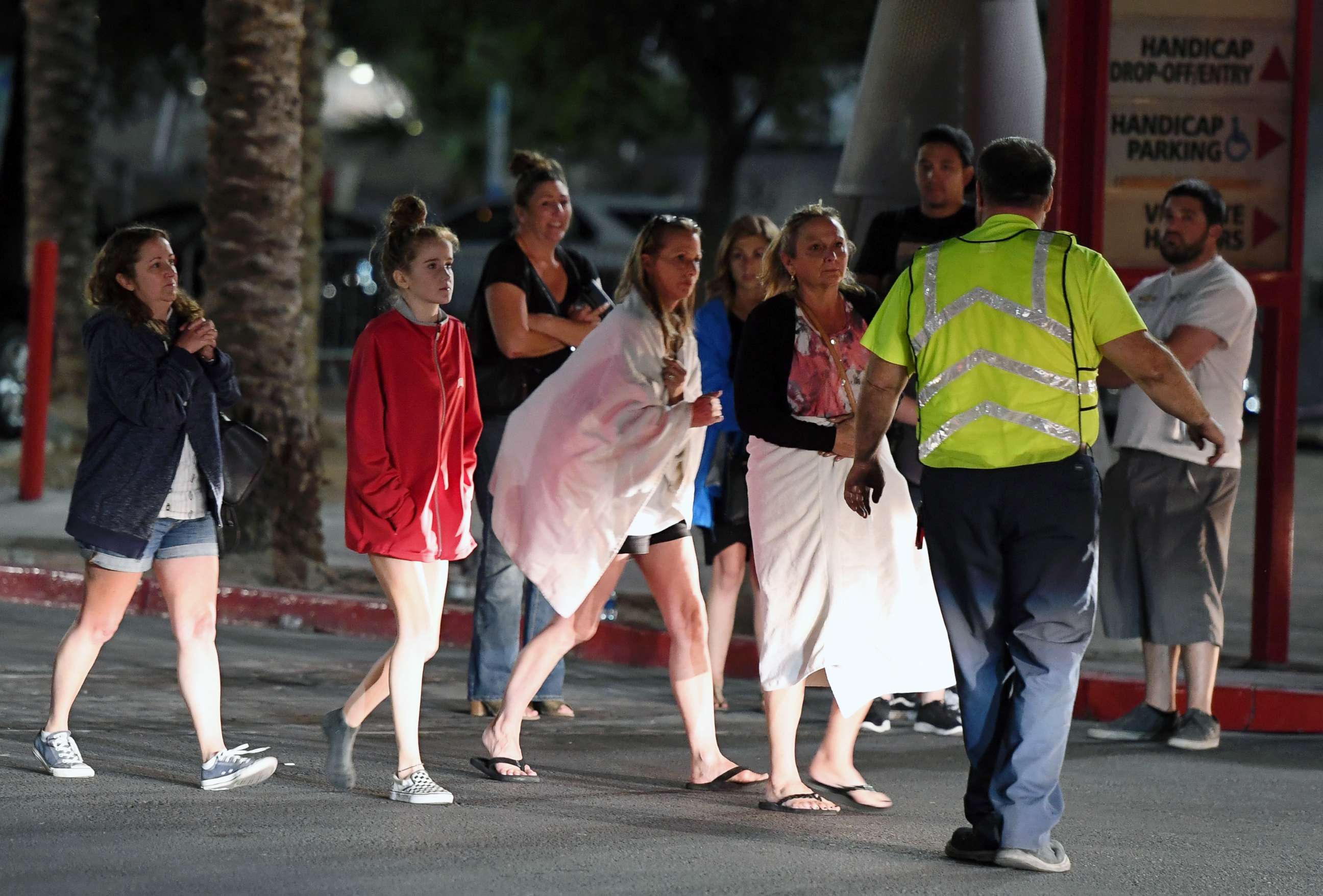 PHOTO: People are directed to rides outside the Thomas & Mack Center after a mass shooting at a country music festival, Oct. 2, 2017, in Las Vegas. 