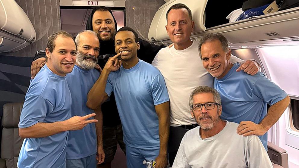 PHOTO: President Donald Trump's Special Missions Envoy Richard Grenell poses on board a plane alongside six U.S. citizens released from detention in Venezuela, Jan. 31, 2025.
