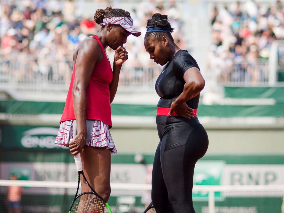   PHOTO: Serena Williams and Venus Williams speak during their match against Andreja Klepac of Slovenia and Maria Jose Martinez Sanchez of Spain in the Women's Doubles Competition at the 2018 French Open Tennis Tournament in Paris, June 3, 2018. 