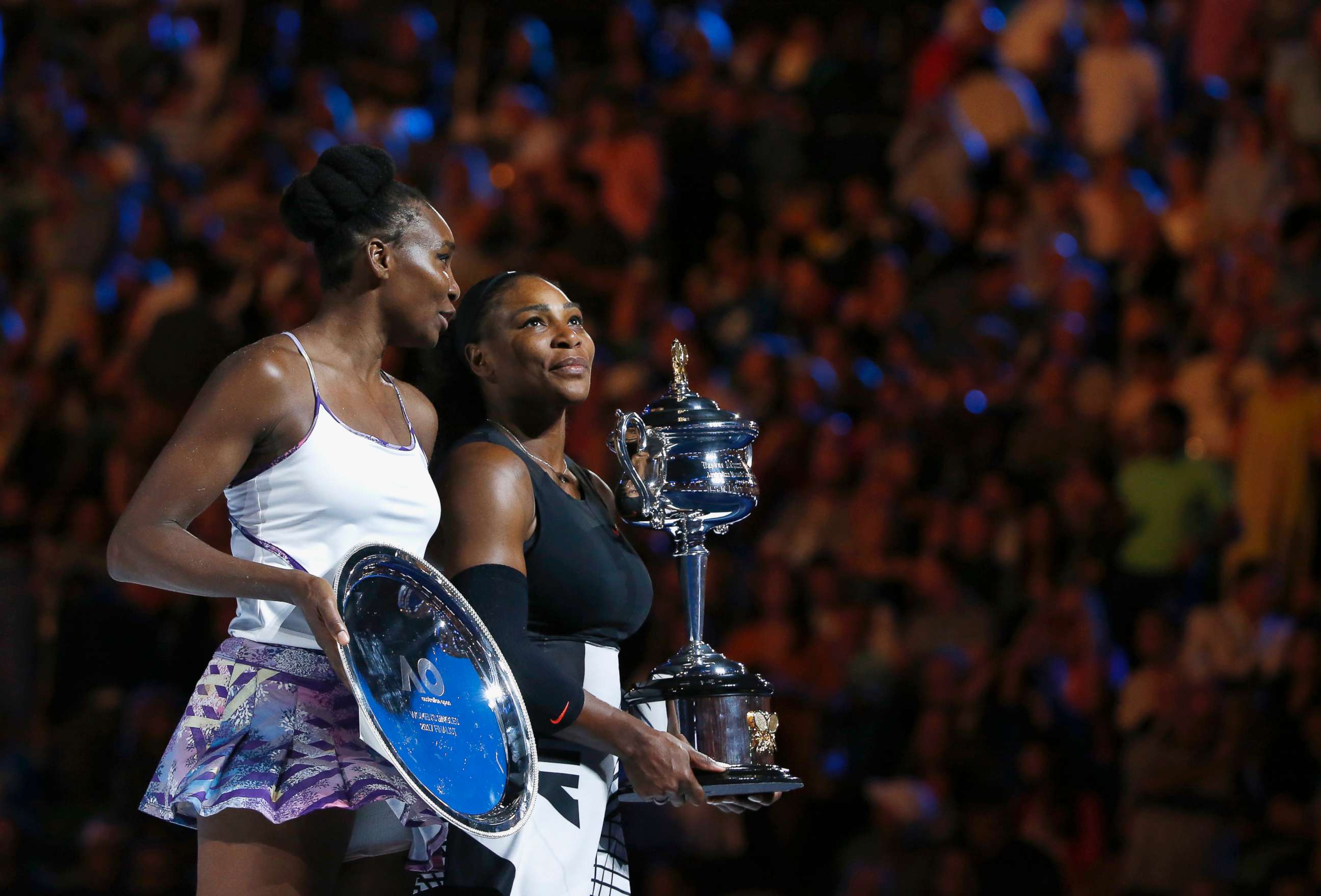 PHOTO: Serena Williams holds her trophy after winning her Women's singles final match against Venus Williams in Melbourne, Australia, Jan. 28, 2017.