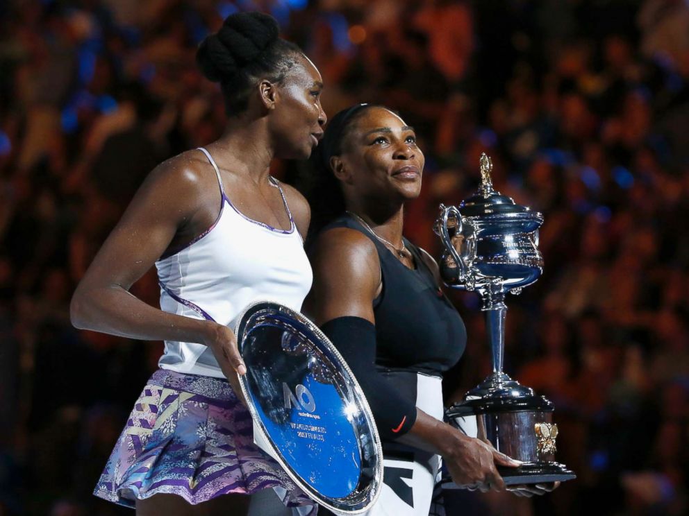   PHOTO: Serena Williams holds her trophy after winning her women's singles final against Venus Williams in Melbourne, Australia, on January 28, 2017. 