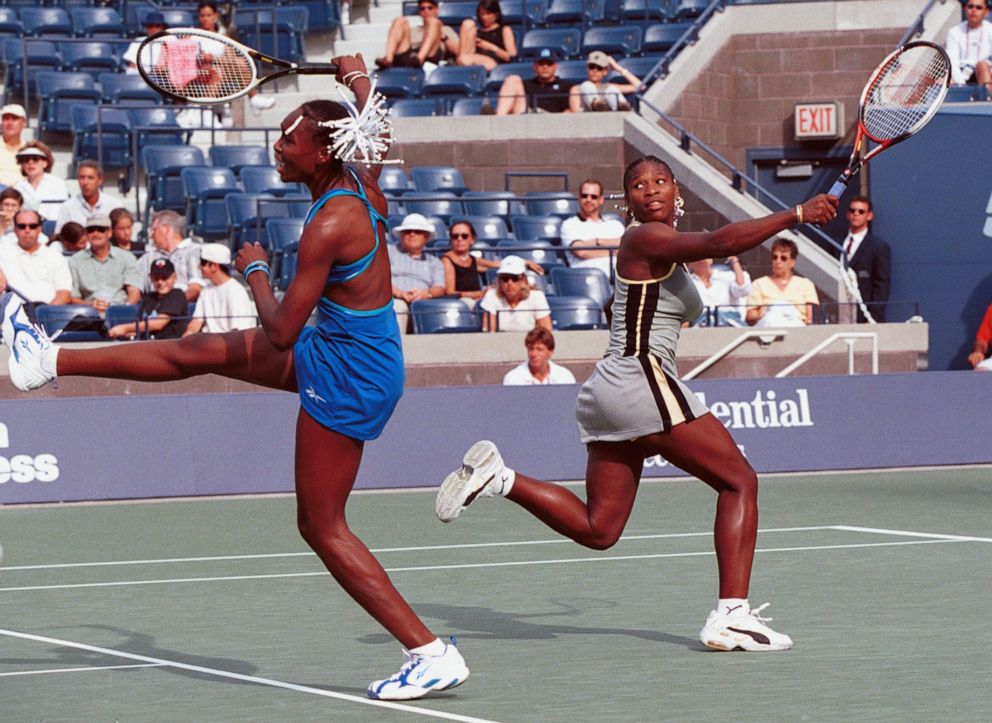 PHOTO: Venus and Serena Williams compete in a doubles match with Japanese players Miho Saehi and Yuka Yoshida in New York, Sept. 02, 1999. 