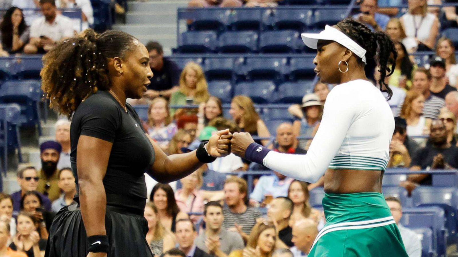 PHOTO: Serena Williams and Venus Williams shake hands during their doubles match against Lucie Hradecka and Linda Noskova during their women's doubles first round match during the US Open Tennis Championships in New York, Sept.1, 2022.