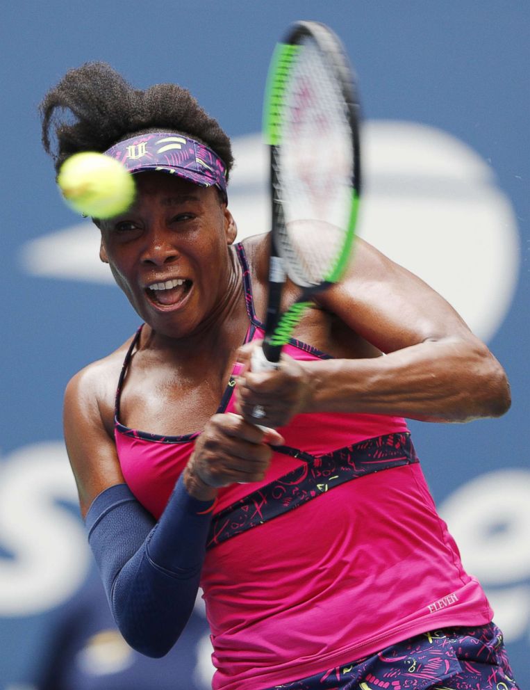 PHOTO: Venus Williams hits a return to Svetlana Kuznetsova of Russia in Arthur Ashe Stadium during the first day of the US Open Tennis Championships in New York, Aug. 27, 2018.